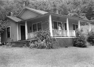 Couple posing on wraparound porch