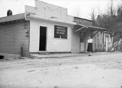 Woman posing outside of restaurant