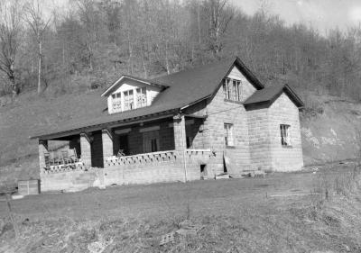 Cinderblock house at bottom of hill