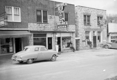 Exterior of East Jenkins Army Goods Store and Whitaker Music Shop