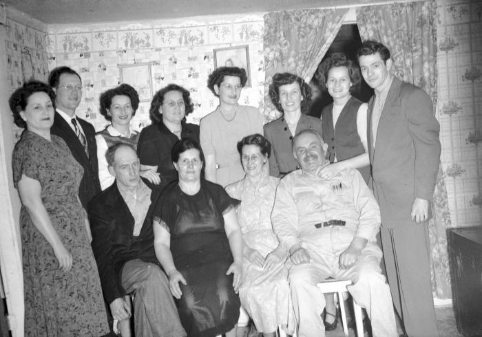 Group portrait of A.J. "Banjo" Haynes and family (Banjo Haynes smiling version)