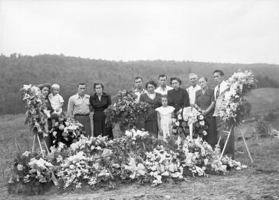 Group portrait at adorned gravesite