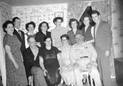 Group portrait of A.J. "Banjo" Haynes and family (Banjo Haynes smiling version)