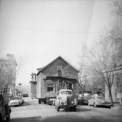 Truck transporting a two-story house