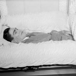 Portrait of deceased man in casket, likely Denver Wright