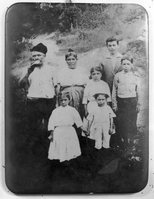 Family portrait with man drinking from flask