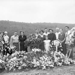 Group portrait at adorned gravesite