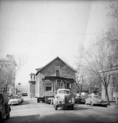 Truck transporting a two-story house