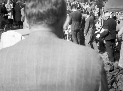 Man blocking view of funeral