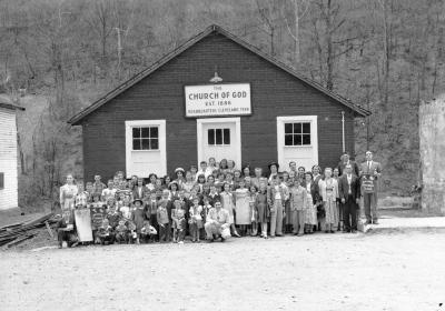 Crowd gathered in front of Church of God Headquarters, centered