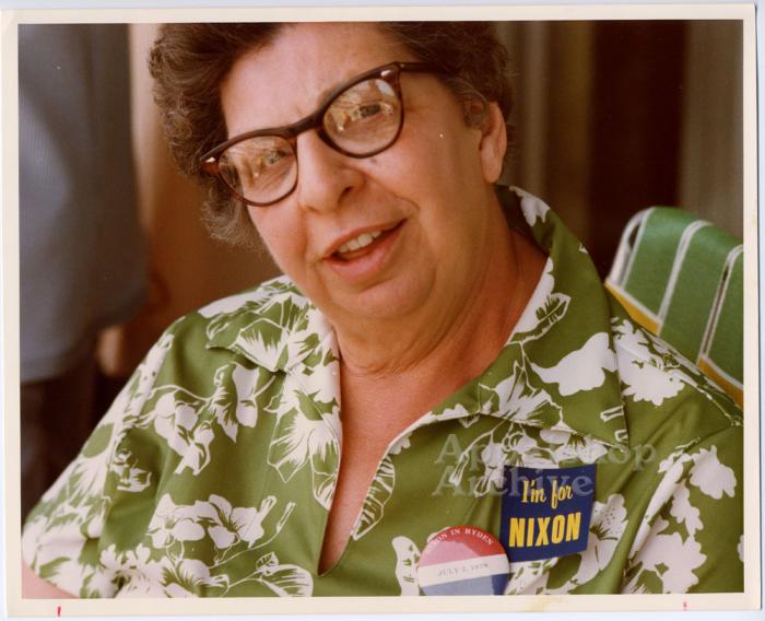 Portrait of woman wearing Nixon campaign items