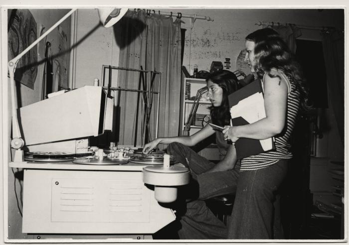 Production still of two women (Elizabeth Barret and Diana Ott) editing film - Kingdom Come School