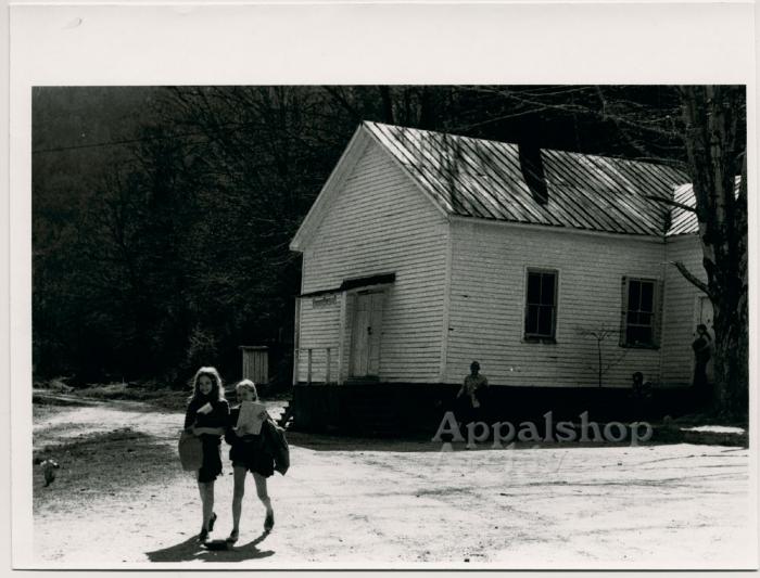Production still of two young girls leaving school - Kingdom Come School