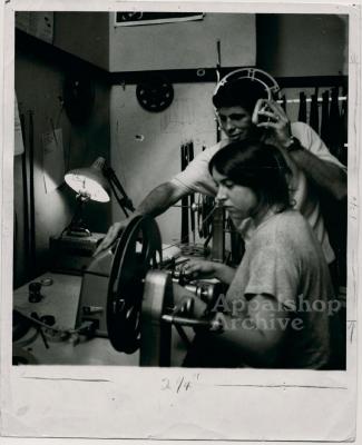Production still of filmmaker [Mimi Pickering] at rewinds - Millstone Sewing Center