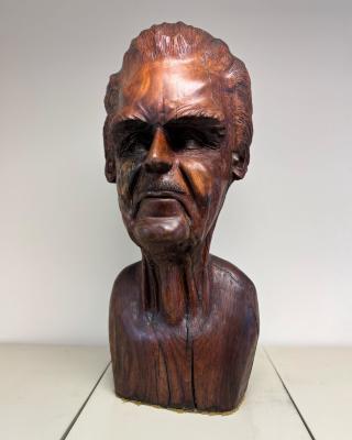 Carved wooden bust self-portrait by Fred Carter