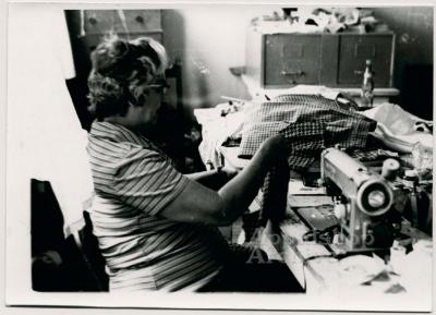 Production still of woman at sewing machine - Millstone Sewing Center