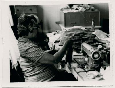 Production still of woman at sewing machine - Millstone Sewing Center