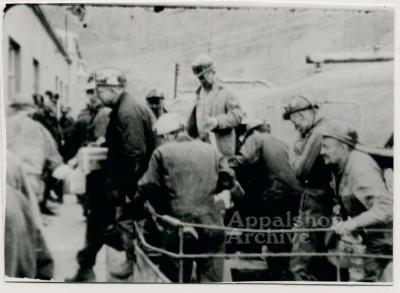 Production still of group of coal miners debording transport, exterior - UMWA 1970: A House Divided