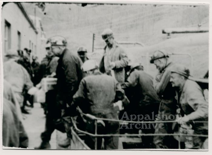 Production still of group of coal miners debording transport, exterior - UMWA 1970:  A House Divided